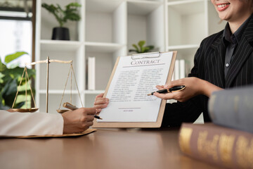close up, Lawyer and businesswomen discussing and introducing Providing legal advice regarding signing insurance contracts or financial contracts