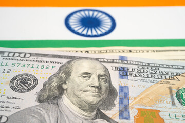 US dollar banknotes on India flag background, Business and finance.