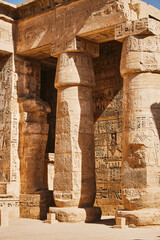 Columns with Egyptian hieroglyphs and ancient symbols. Famous Egyptian landmark. Visiting ancient Egypt - 757907975