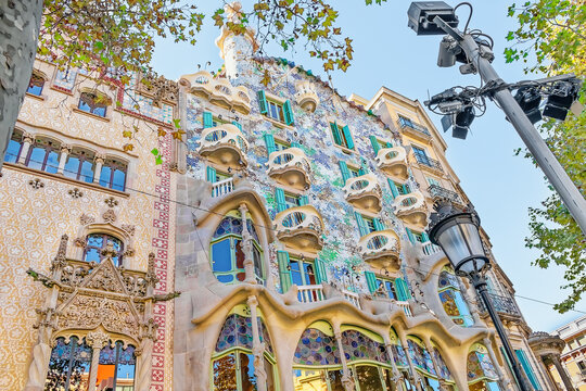 Barcelona, Spain - November 26, 2021: Bottom view of the facade of the Casa Batllo building in Barcelona on an autumn evening. Exterior view of a famous Spanish landmark, close-up