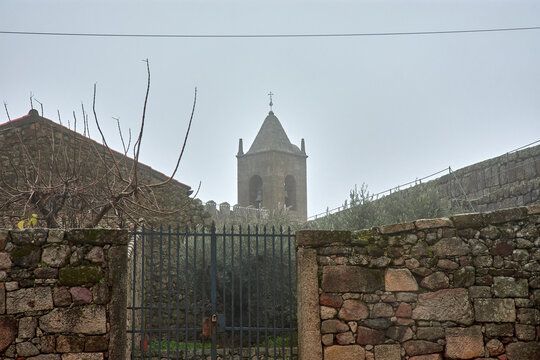 Castle walls and tower among the fog of Penamacor in Portugal