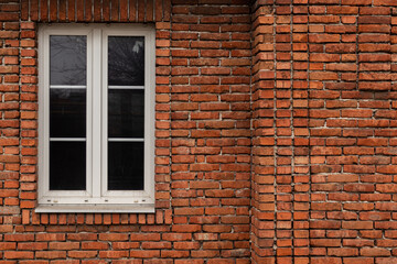 Old Brick Wall with White Window