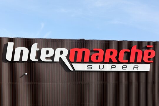 Chatillon, France - February 13, 2024: Intermarche logo on a facade. Intermarche is the brand of a general commercial French supermarket, part of the large retail group Les Mousquetaires	
