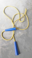 Yellow skipping rope on the floor 