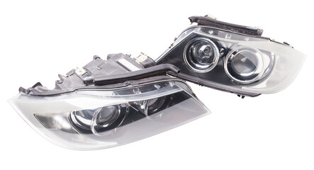 Stylish xenon headlight of a German car - optical equipment with a lamp inside on a white isolated...