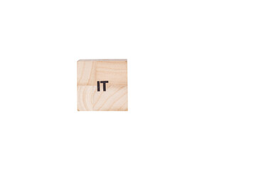 wooden cubes with the inscription It on a white isolated background close-up