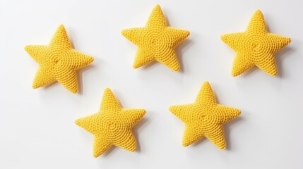 Knitted stars on a monochrome colored background, top view, with space for text. Greeting card, hobby, knitting, children's toy.