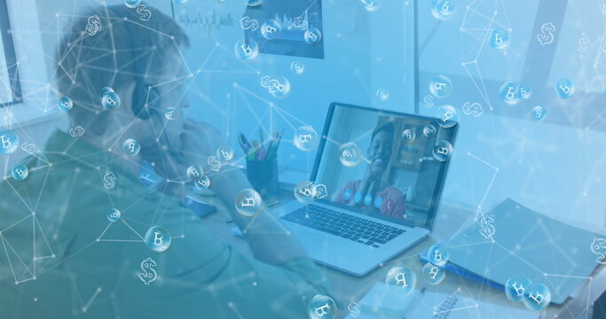 Image of bitcoin icons over caucasian man using phone headset and laptop - Powered by Adobe