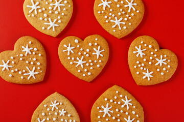 beautiful hand-baked cookies in the shape of a heart on a red background