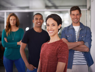 Obraz premium Businesswoman, happy and office portrait with team, creative and professional career. Leadership, female person and confident with diversity coworkers in collaboration and standing together.