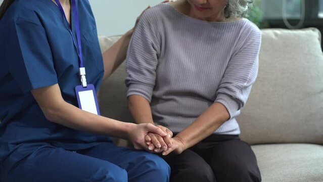 Female doctors shake hands with patients encouraging each other To offer love, concern, and encouragement while checking the patient's health. Concept Health care and Social Security