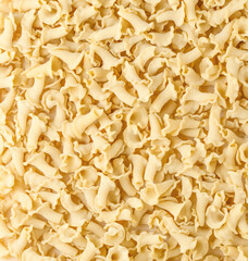 Uncooked Italian pasta Campanelle background. Gigli Pasta top view. High quality photo.