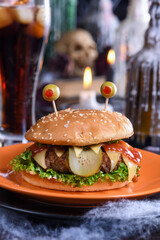 The Monster Burger will definitely lift your spirits and is the perfect snack for a Halloween party. - obrazy, fototapety, plakaty