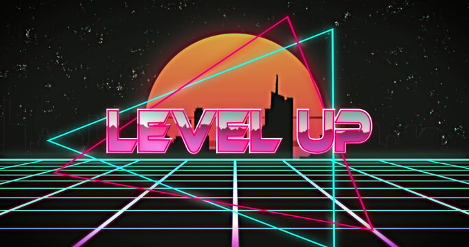 Naklejki Image of level up text in multicolored triangle against silhouette cityscape and sun