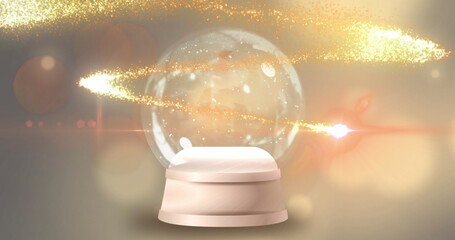 Golden shooting star over christmas tree in a snow globe against spots of light on yellow background