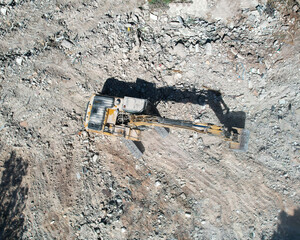 Excavator cleaning construction site for a new construction project.