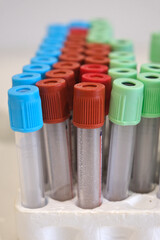 Blood sampling equipment on a clear background. Tube, pump body, adhesives, needles, tourniquet,...