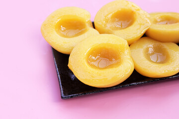 Peach halves in syrup. Fruity desserts