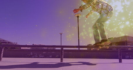 Image of light spots over caucasian man skateboarding