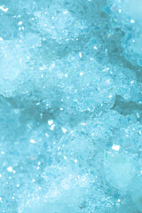 Blue Crystal Mineral Stone. Gems. Mineral crystals in the natural environment. Texture of precious and semiprecious stones. Seamless background with copy space colored shiny surface of precious stones