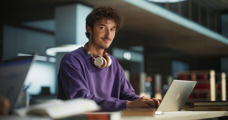 Portrait of a Handsome European Student Studying in a Traditional Library. Young Male Looking at...