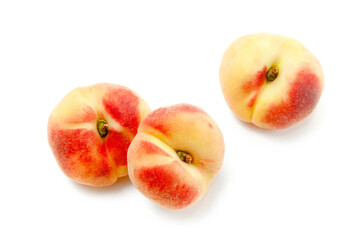 Three saturn peaches or flat peaches isolated on white background with clipping path..