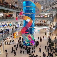 Russia, Moscow, Aviapark shopping center, colored dragon, people walking in the city