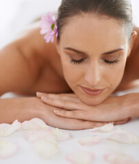 Zen, massage and face of woman at spa for health, wellness and balance with luxury holistic treatment. Self care, relax and girl on table for body therapy, comfort and calm pamper service at hotel - obrazy, fototapety, plakaty