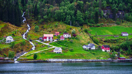 Mountains and Fjord over Norwegian Village in Olden, Innvikfjorden, Norway - obrazy, fototapety, plakaty