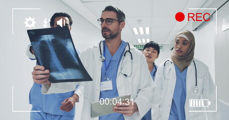 Portrait of diverse doctors displayed on a camera in record mode.