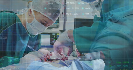 Stock market data processing over male and female surgeons performing operation at hospital
