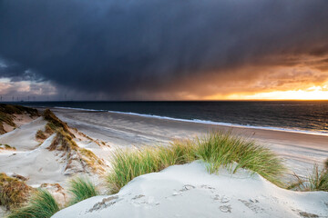 view on dramatic sunset over sea during rain shower - 757951944
