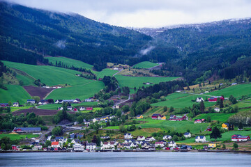 Mountains and Fiord over Norwegian Village in Olden, Innvikfjorden, Norway, Europe