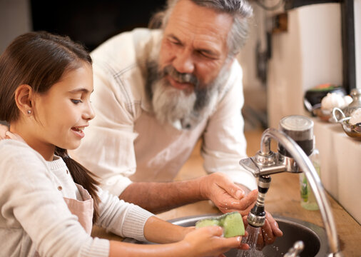 Grandfather, child and washing hands with water to clean in kitchen, skincare and safety. Mature man, grandchild and liquid for protection against bacteria, learn and hygiene to prepare for cooking