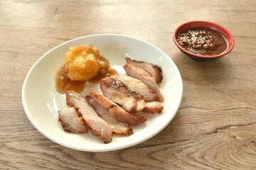 grilled pork neck with mashed potato dressing gravy on plate dipping spicy sauce 