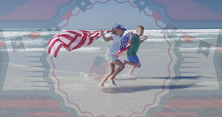 Image of cotillion and usa flags over happy caucasian girl and boy running on beach
