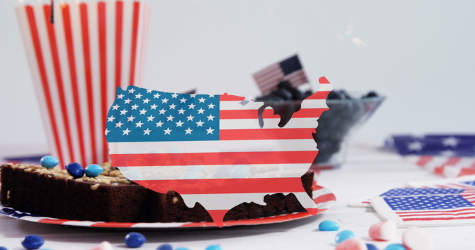 Naklejki Image of usa map in colours on usa flag over cakes and desserts