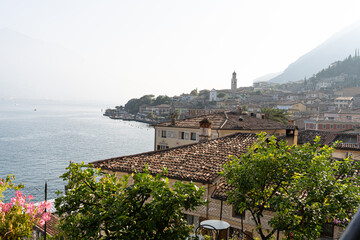 view of the town Limone sul Garda overlooking the lake and mountains on a sunny day
