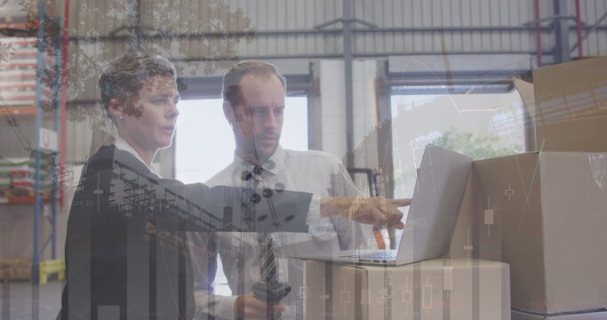 Image of financial data over caucasian male and female warehouse workers