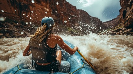 A female rafting in rapid water in rugged lands.