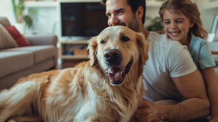 A happy smiling family next to their dog, smiling and playing at home