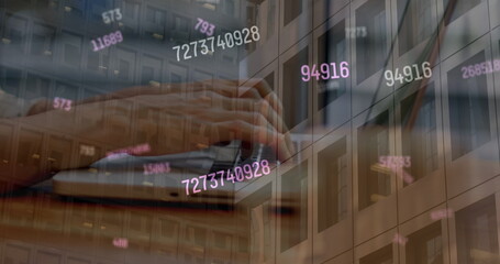 Image of financial data over caucasian woman using laptop and office building