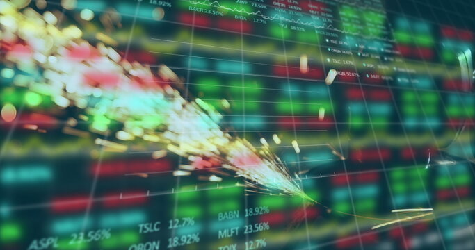 Image of trading board and graphs over close-up of sparkling fire