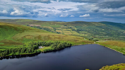 Obraz premium From the heights of the peak, Lough Bray Lower unfolds below like a breathtaking painting.