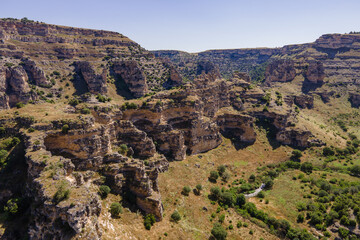Fototapeta na wymiar Rocky cliff inside Ulubey canyon in Turkey, Aerial tilt up shot