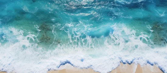 Fotobehang Ocean Serenity: Powerful Waves Crashing on Tropical Sandy Beach © Ilgun