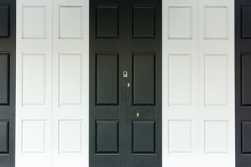 Background of modern black white painted door and padlock