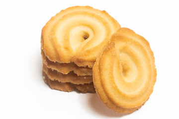 Stacked of danish butter cookies the vanilla ring cookie isolated on white background clipping path