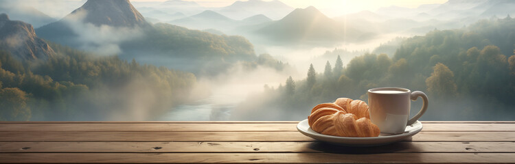 : A cup of coffee and croissants lie on the wooden window sill by the window overlooking the big mountains and forest. - obrazy, fototapety, plakaty