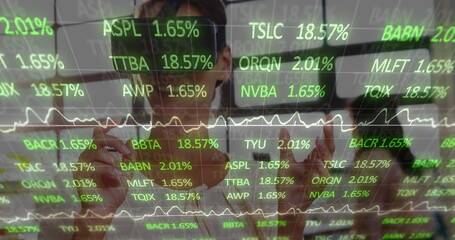 Image of financial data processing over businesswoman wearing vr headset